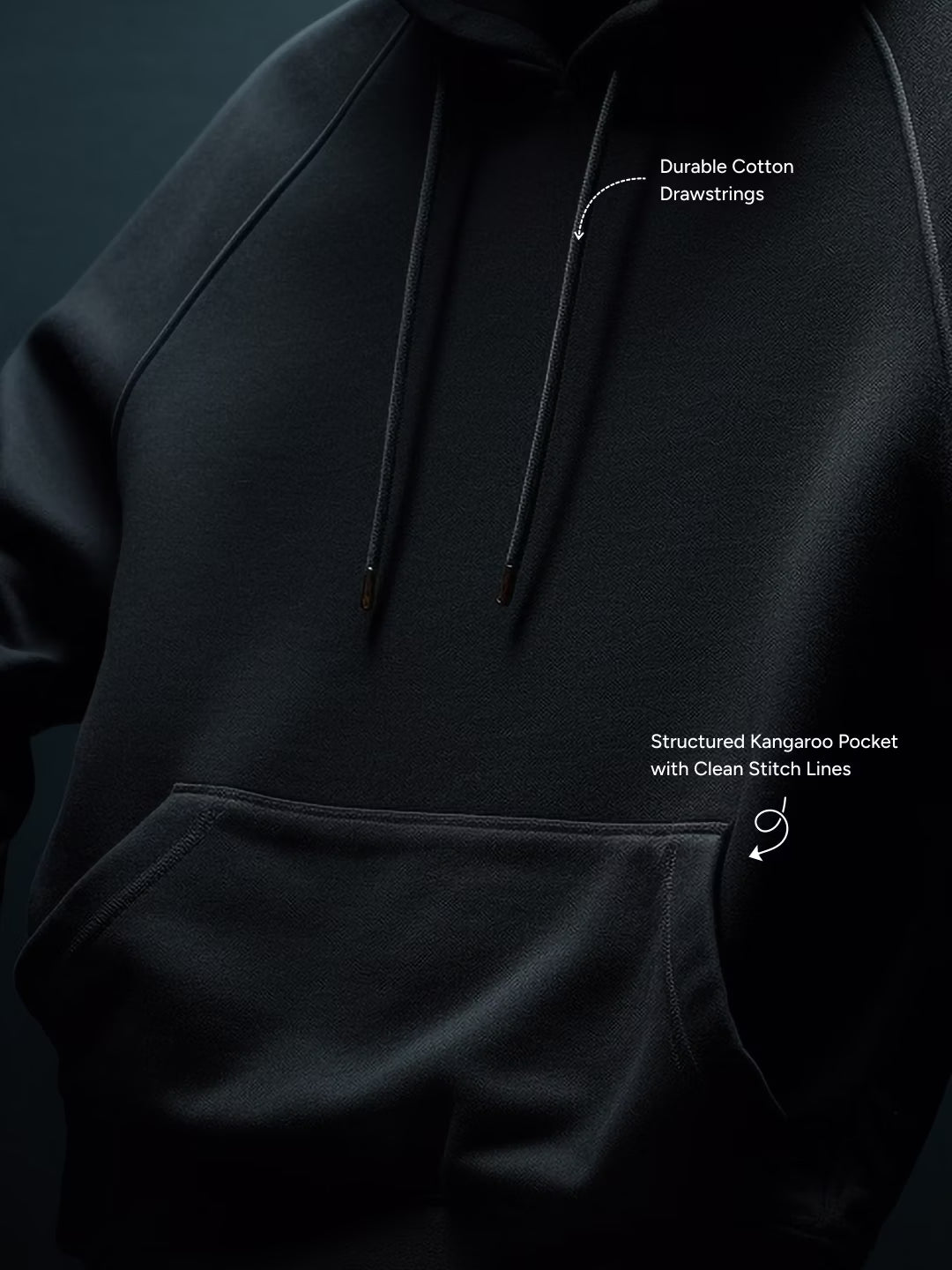 Black hoodie with text labels on durable cotton drawstrings and structured Kangaroo pocket.